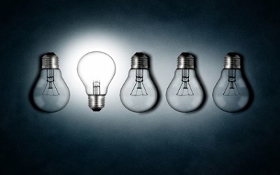 illuminated-lightbulb-amid-dim-bulbs--creativity-and-innovation
