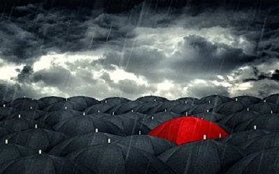 red-umbrella-mingling-with-grey-umbrellas--be-different-concept